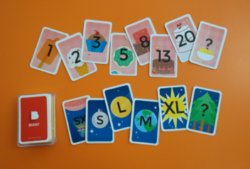 Sets of Boost planning poker cards laid out on a table. 