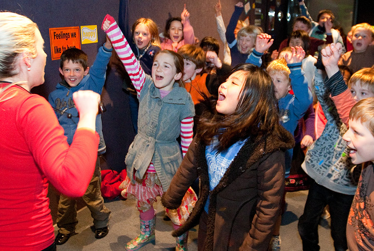 Kids cheering in Life Education lesson. 