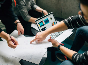 Team discusses user stories 348x257