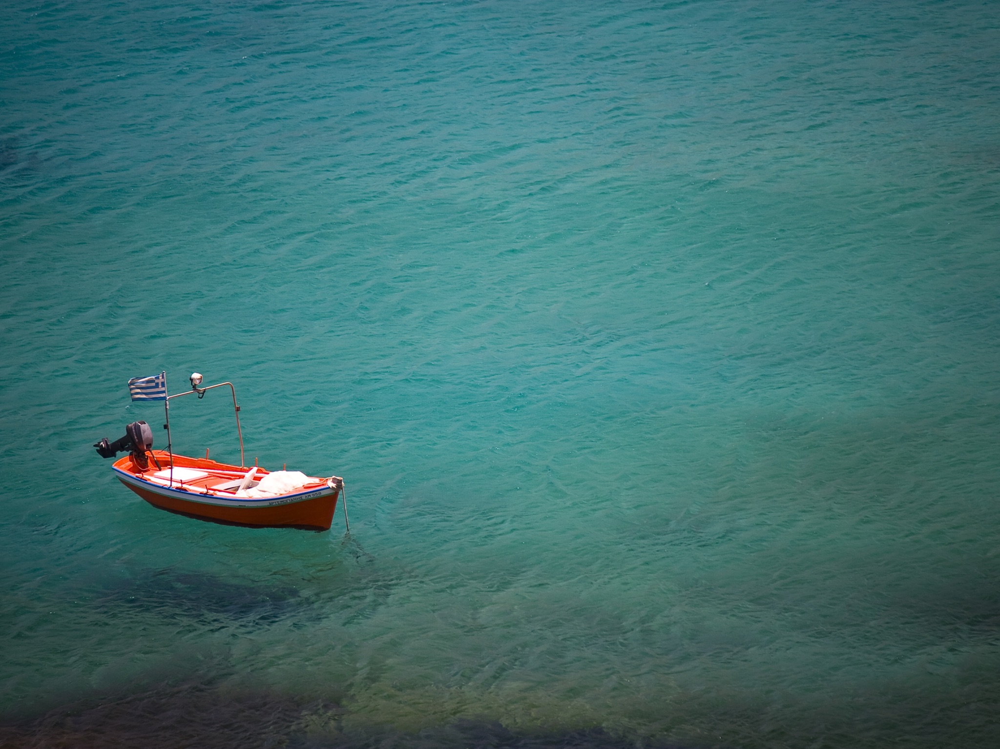 A small boat on anchored at sea. Knowing the history of Scrum and how that led to the structure of scrum helps anchor your understanding.