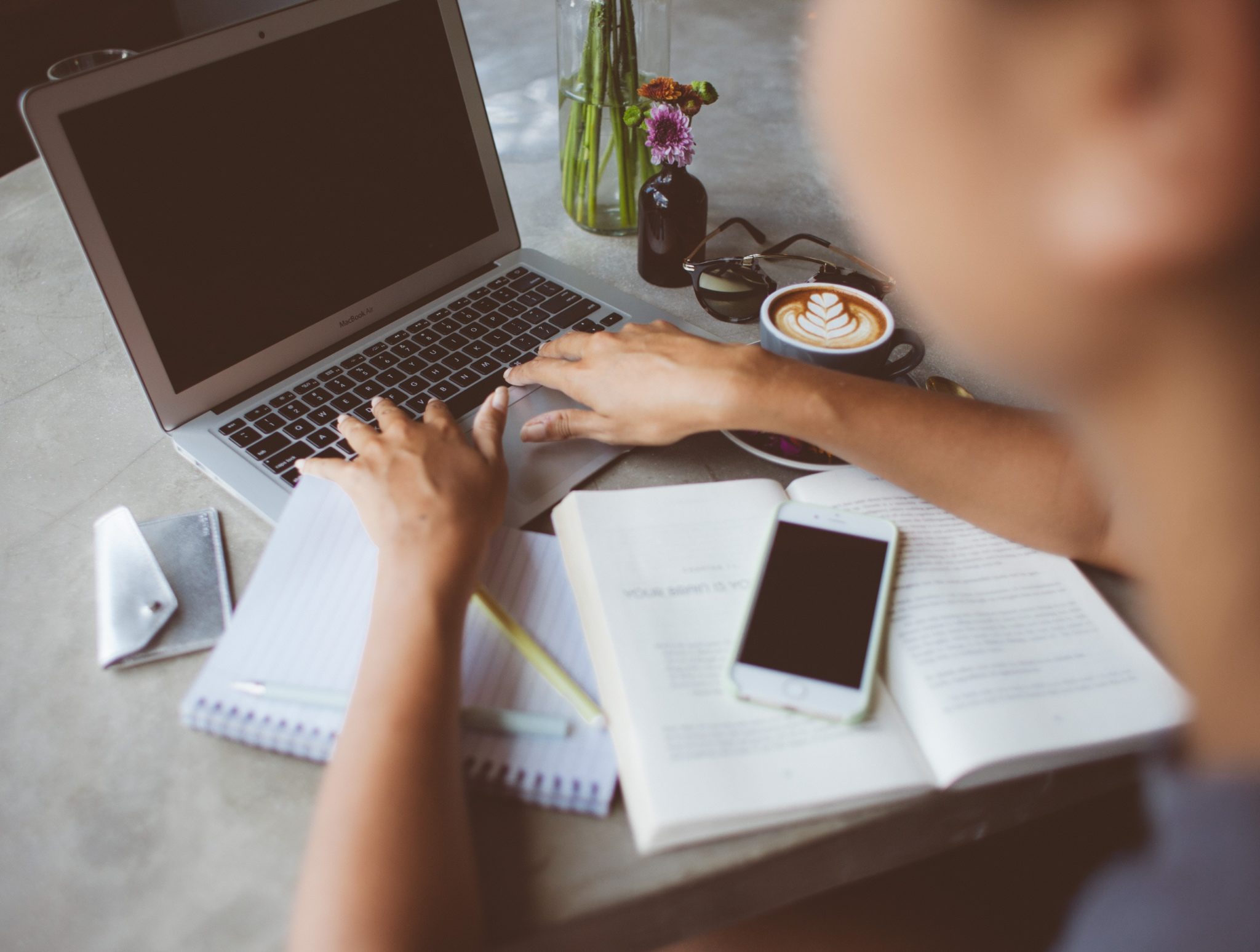 Working on a laptop. Get tips on writing a business blog for busy people. Photo by Juliette Leufke on Unsplash.com.