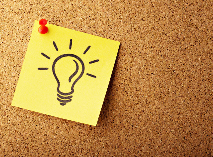 Picture of a lightbulb on a post-it. Product discovery starts with an idea.